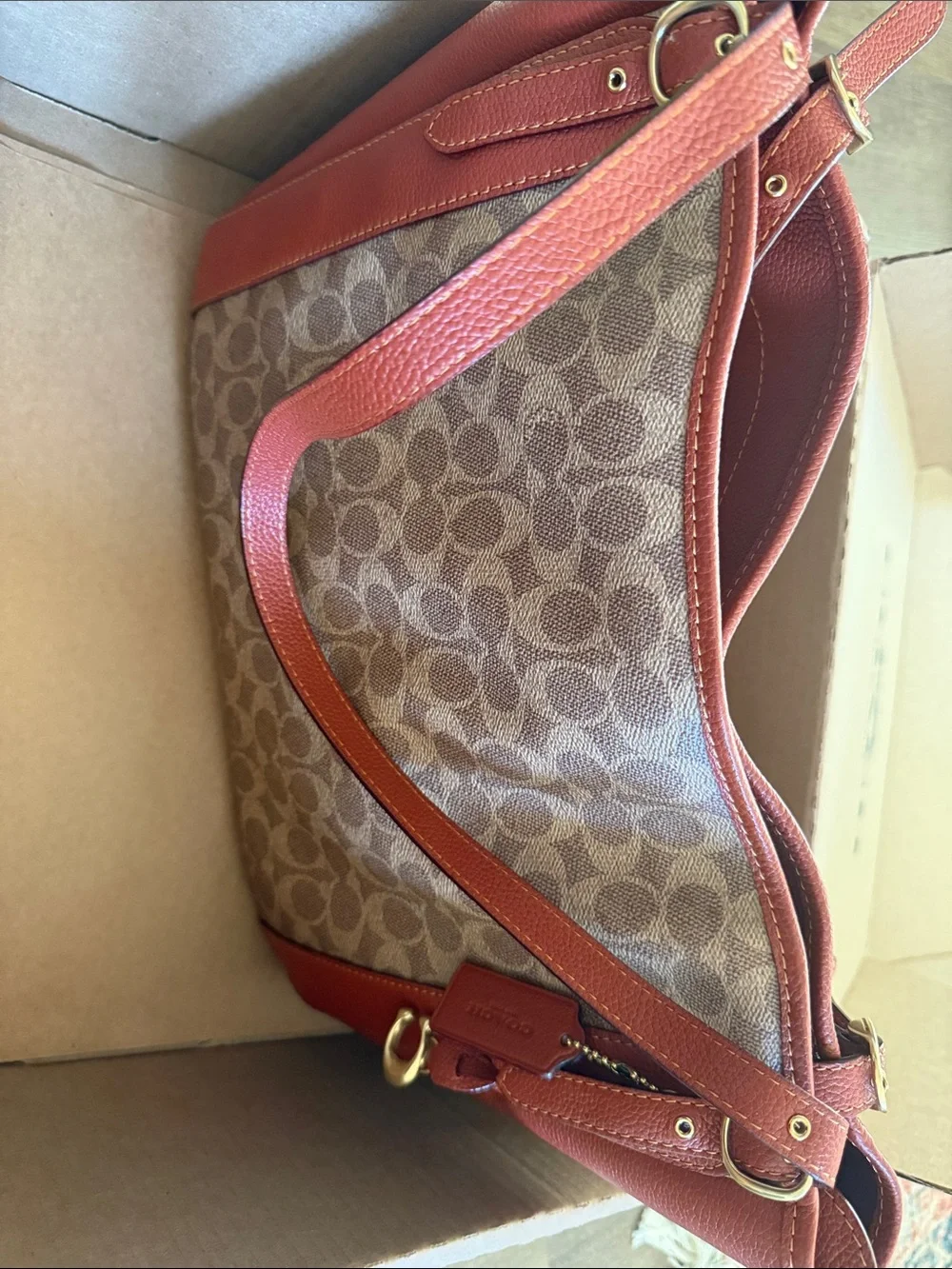 Coach Monogram Canvas Shoulder Bag in Orange.